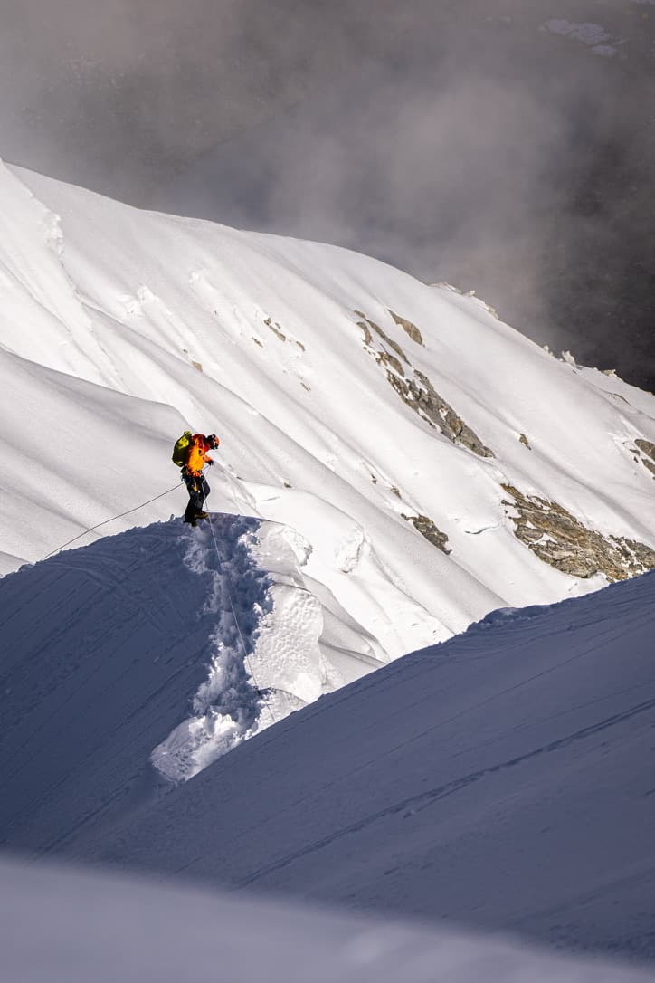 Climber on a snowy ridge
